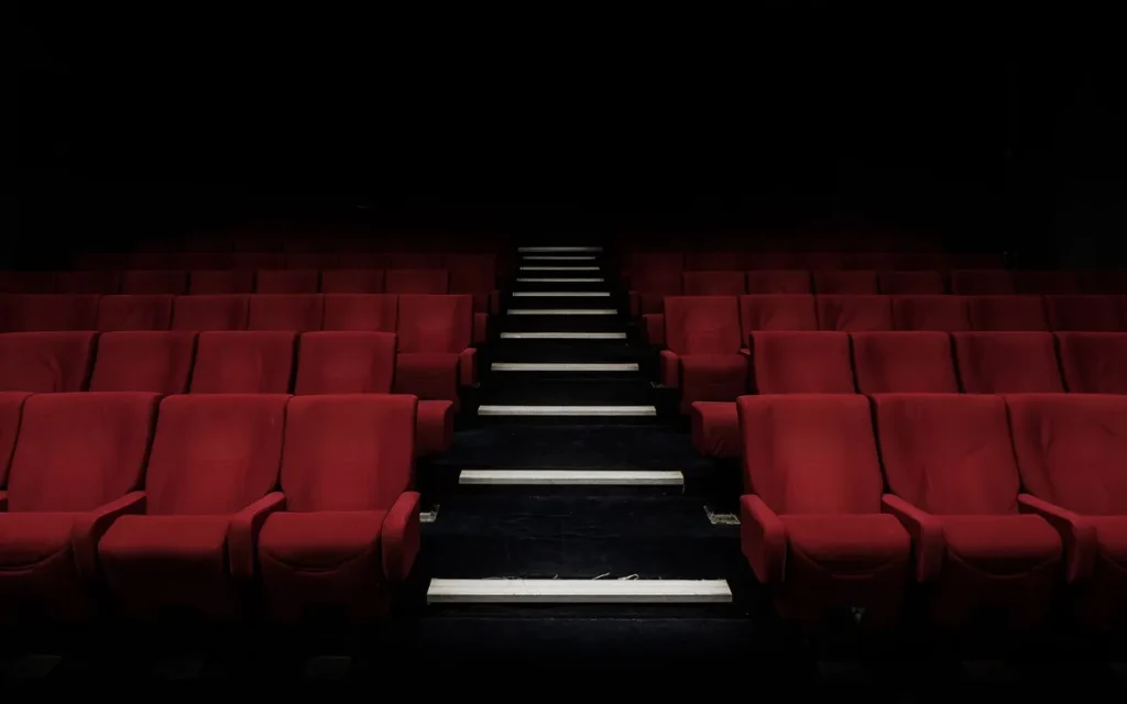 Red theater seats illustrating IPTV catch up for shows you missed