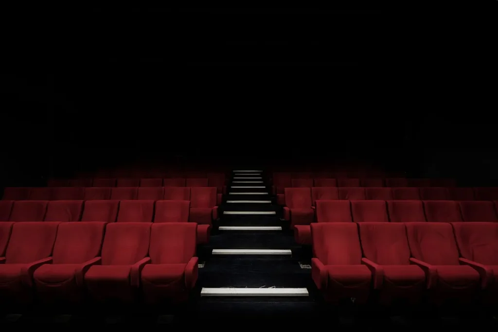 Dark theater seats representing an IPTV service USA viewers can enjoy at home
